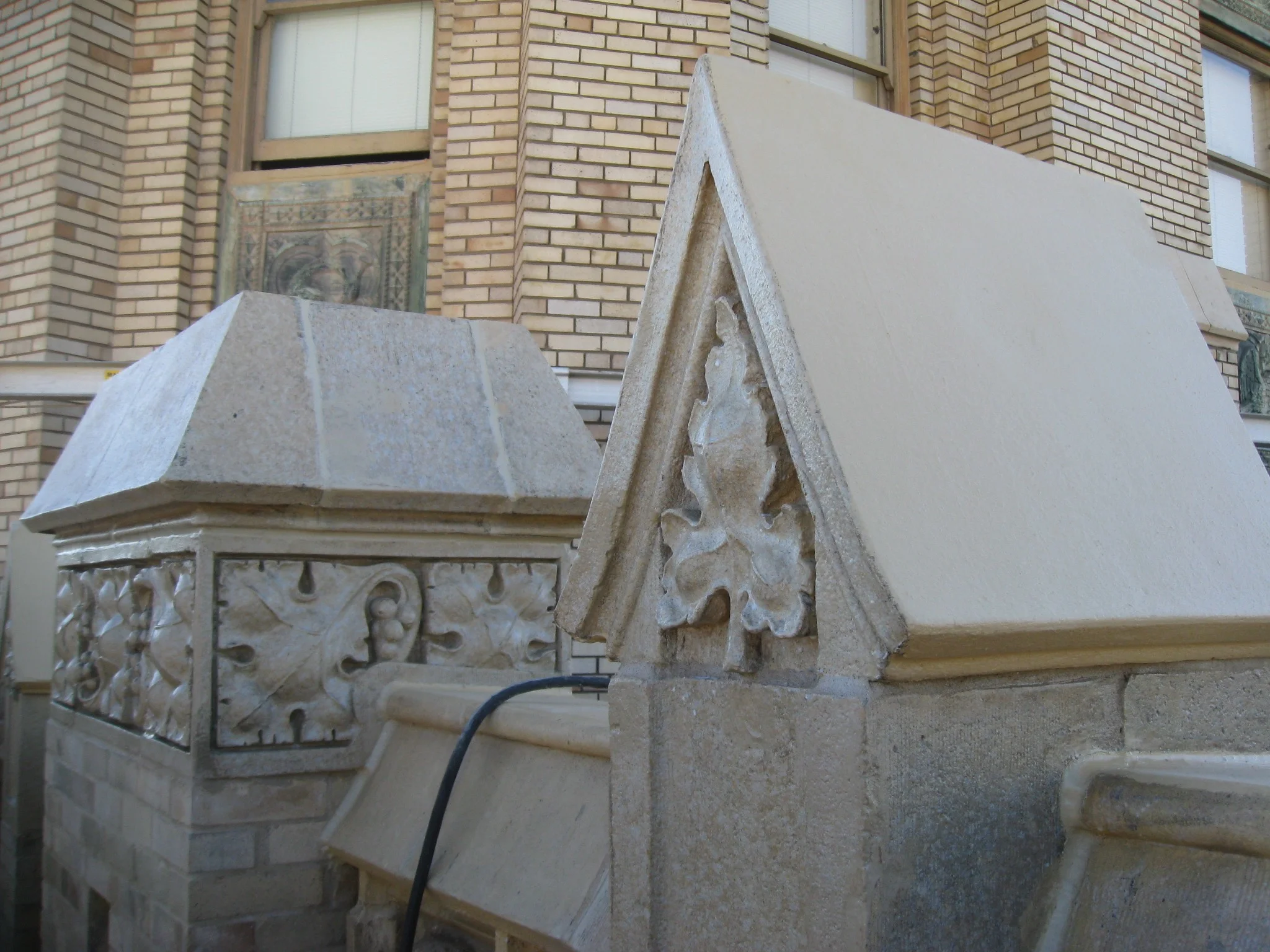 Ornamental terra cotta detailing as viewed from the street-side