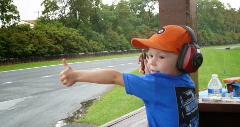 WINNER: Jeanne Burton Fryer - Young boy with thumbs up at a MARRS race. 