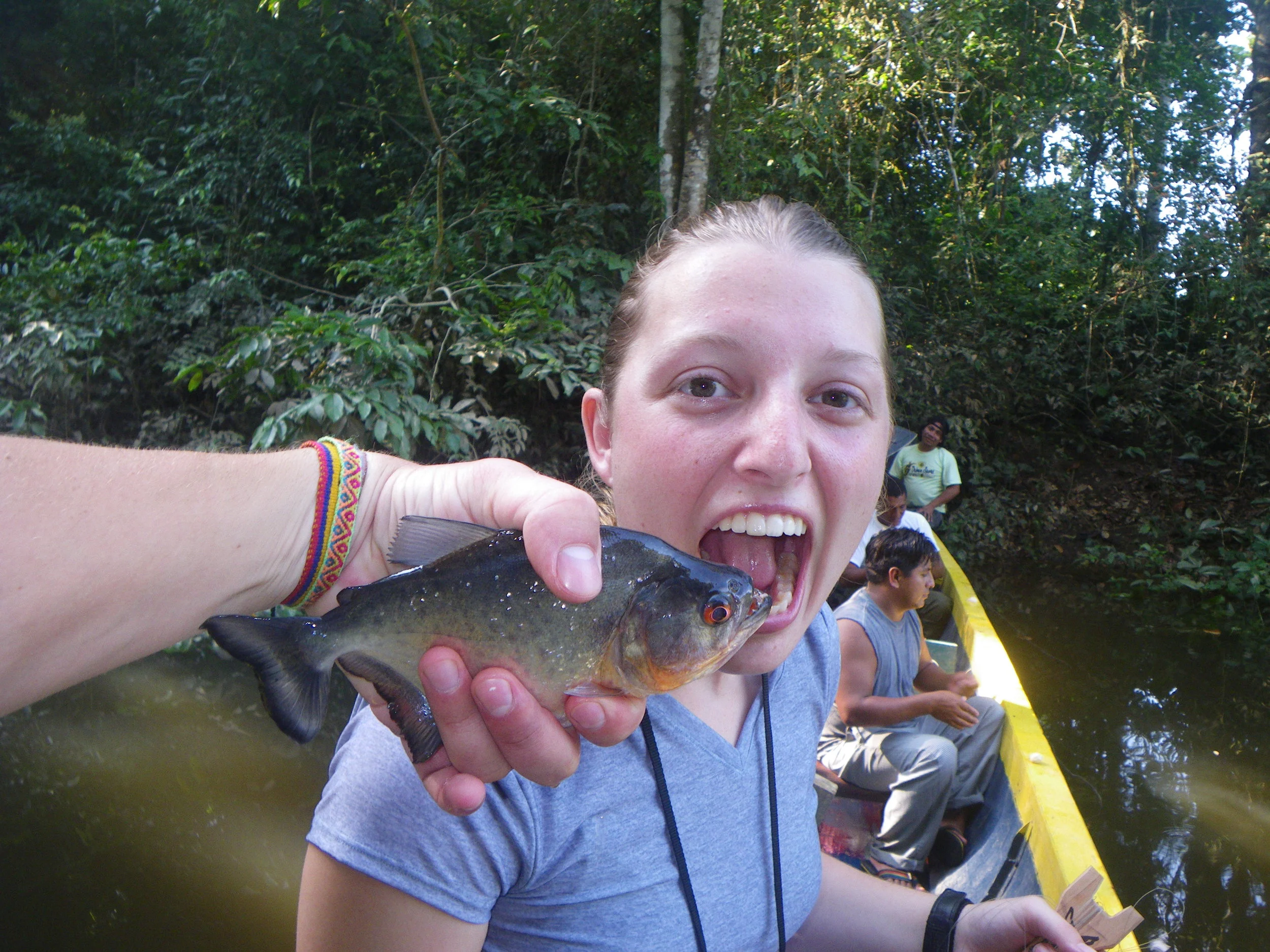  Melanie with a piranha we caught in the Amazon. 