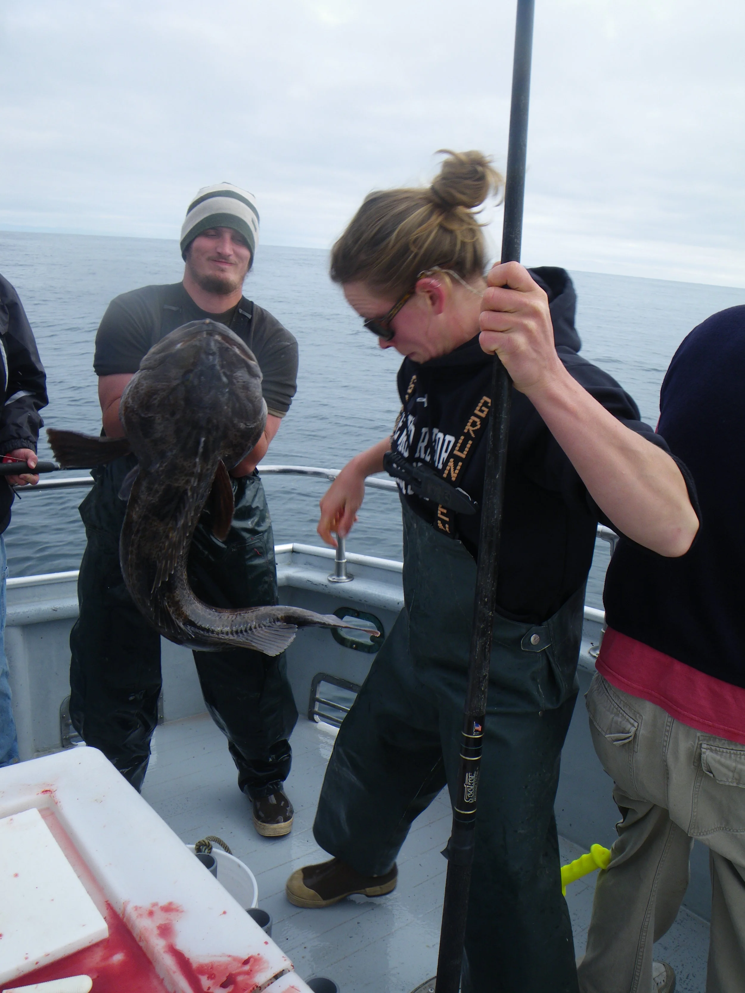  Action shot 1 - grabbing the fish and holding it for Abbey. 