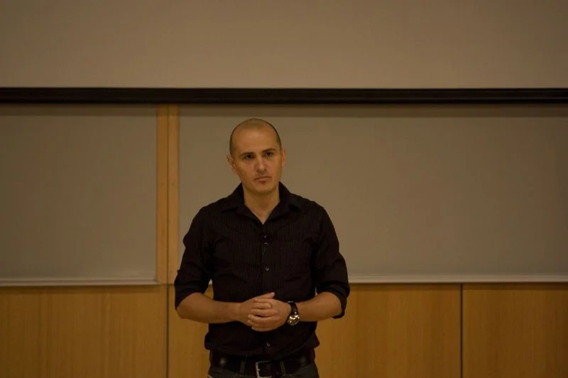 Cristian Mitreanu introduces a speaker.