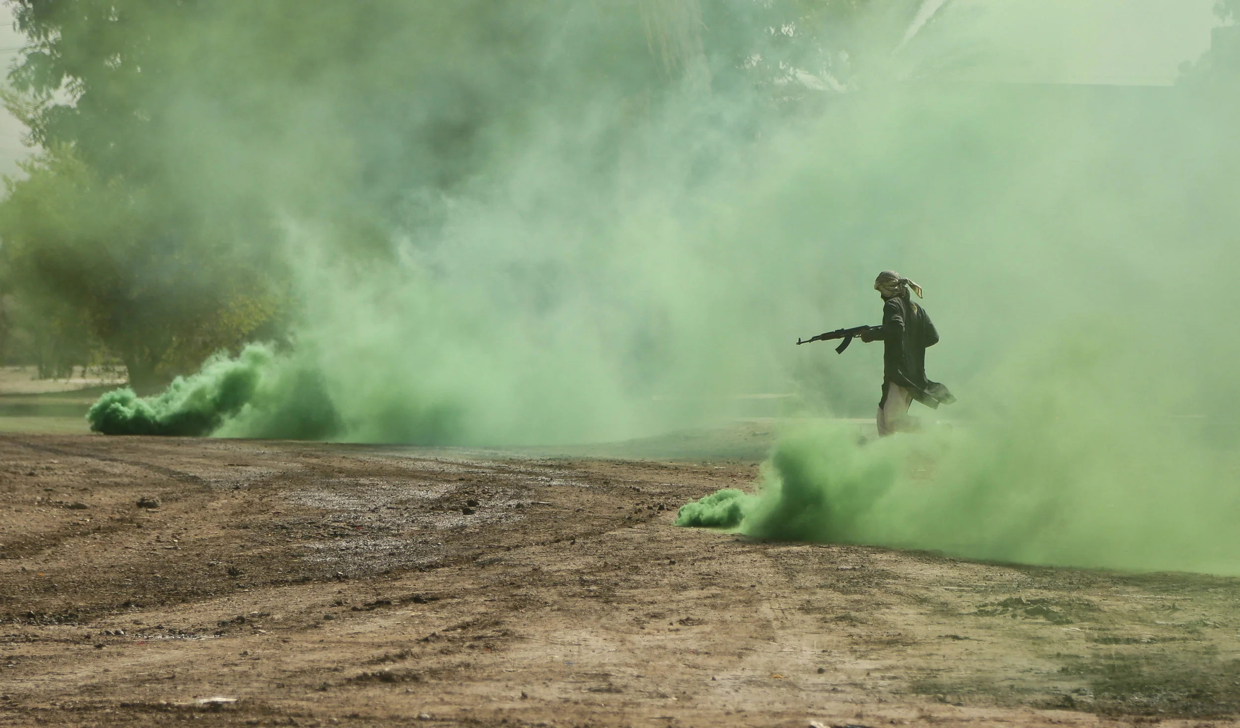 An Iraqi commando plays the role of an Islamic State militant in a training exercise ahead of the operation to re-take Mosul from IS, in Baghdad on Aug. 13, 2016. 