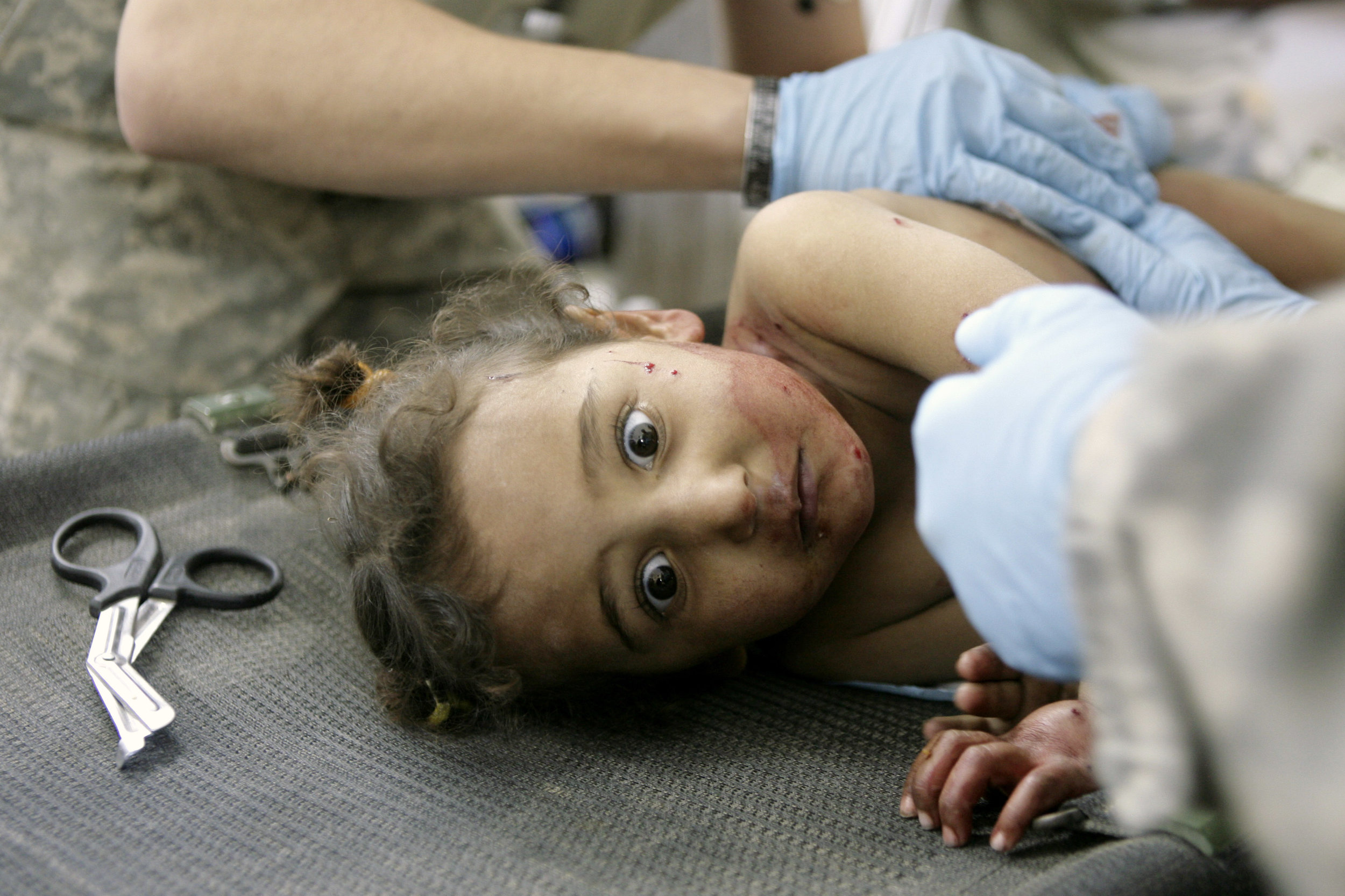 A girl is treated by American medics after a mortar struck while she was playing outside in the town of Arab Jabour on Dec. 11, 2007. 