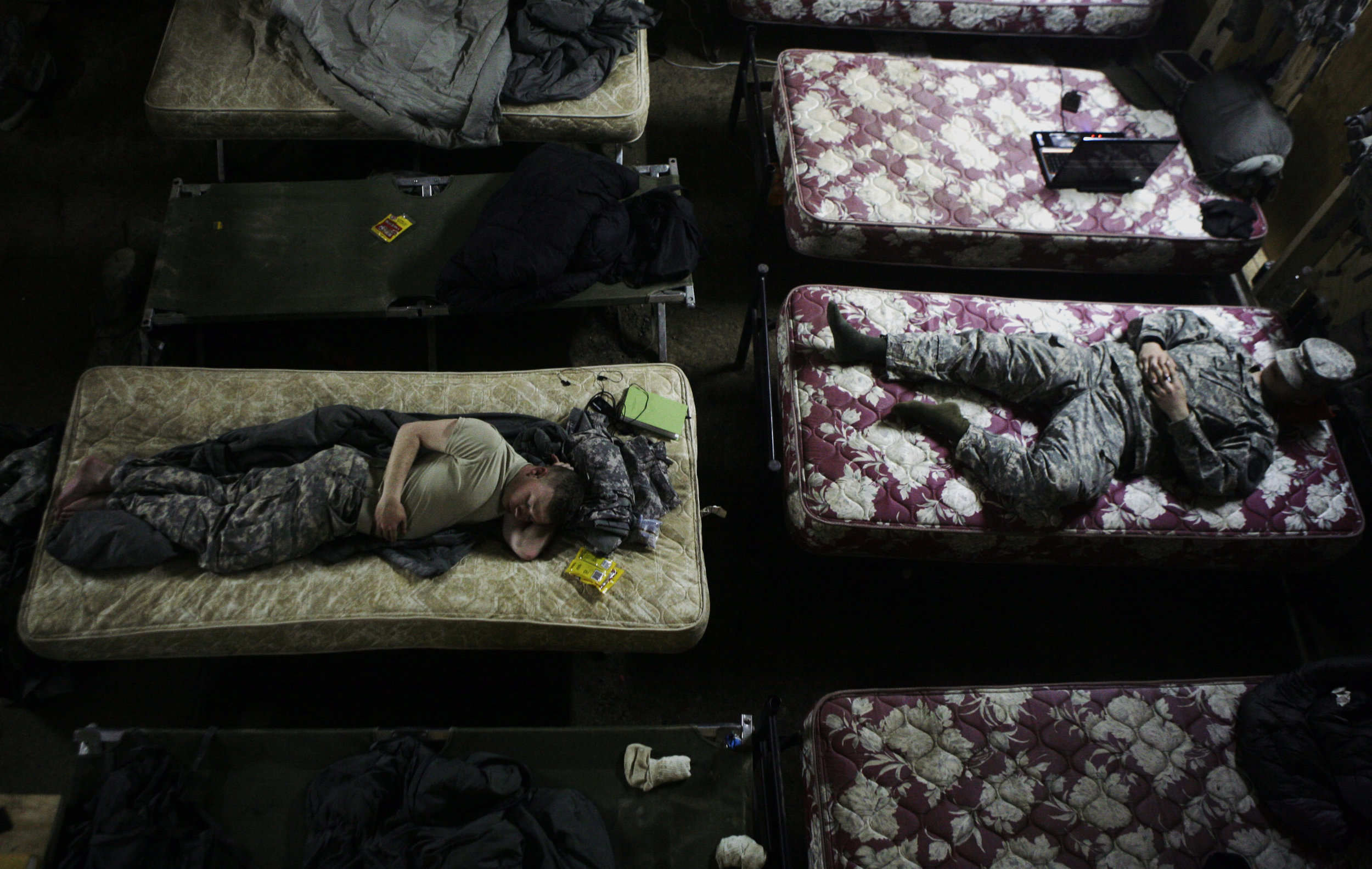 U.S soldiers rest in their makeshift barracks at Combat Outpost Rabiy in Mosul on March 18, 2008.