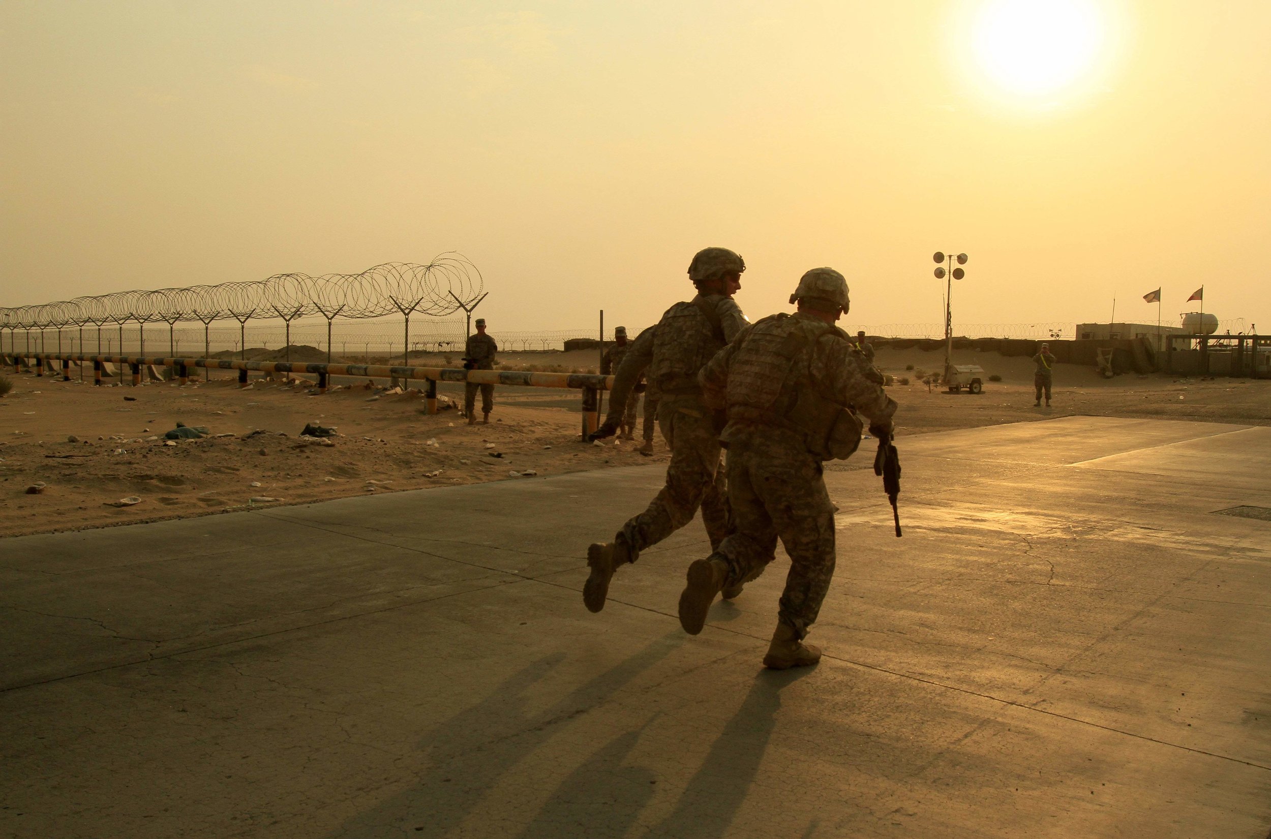 U.S. soldiers race toward the border from Iraq into Kuwait on Aug. 18, 2010. The soldiers were part of the last combat brigade to leave Iraq as part of the drawdown of U.S. forces. 