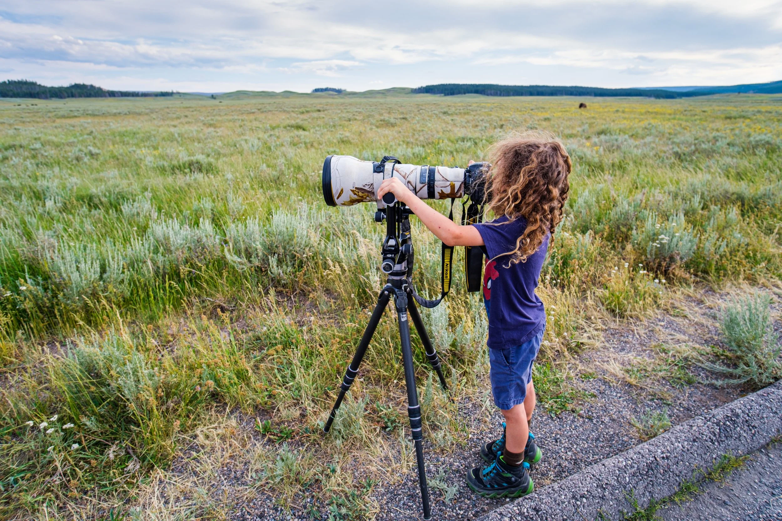 Eli using a 600mm lens to photograph wildlife in yellowstone
