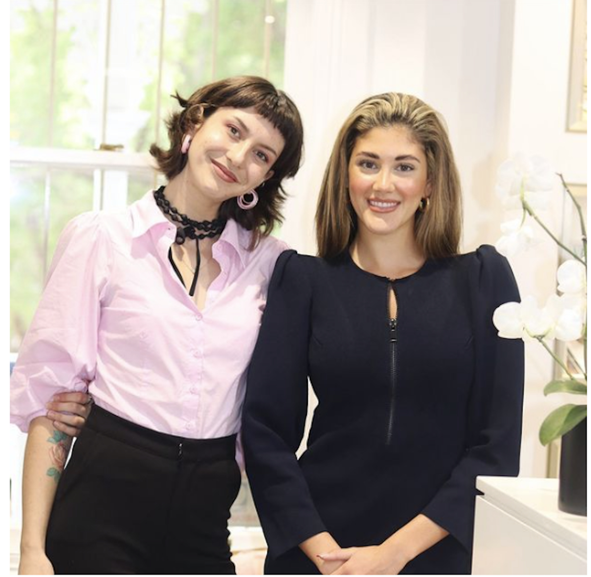 two young woman with brown hair in the waiting room at Brisbane Smile Boutique aesthetic dental practice in Spring Hill, in inner city Brisbane