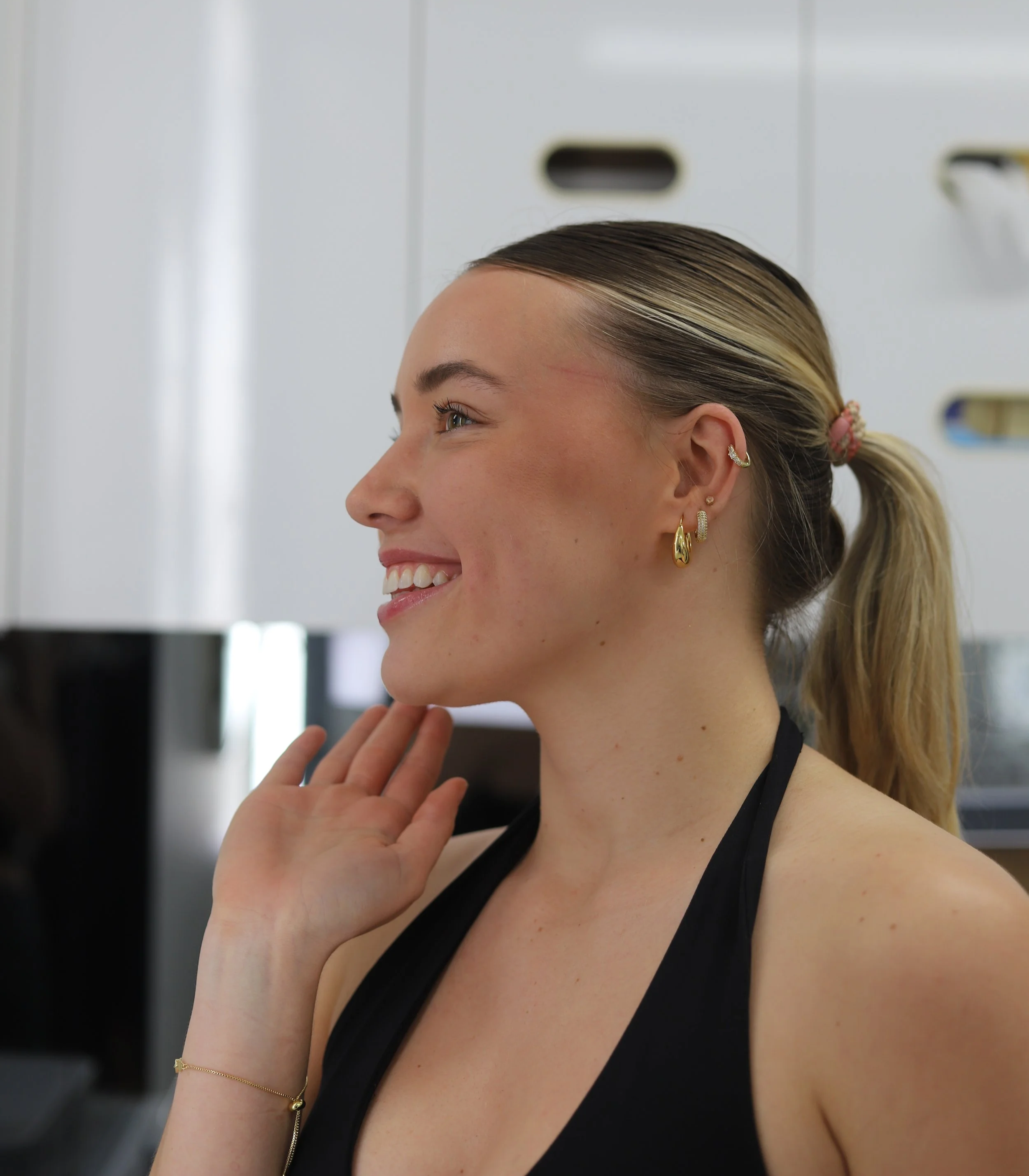 female looking in the mirror at the dentist