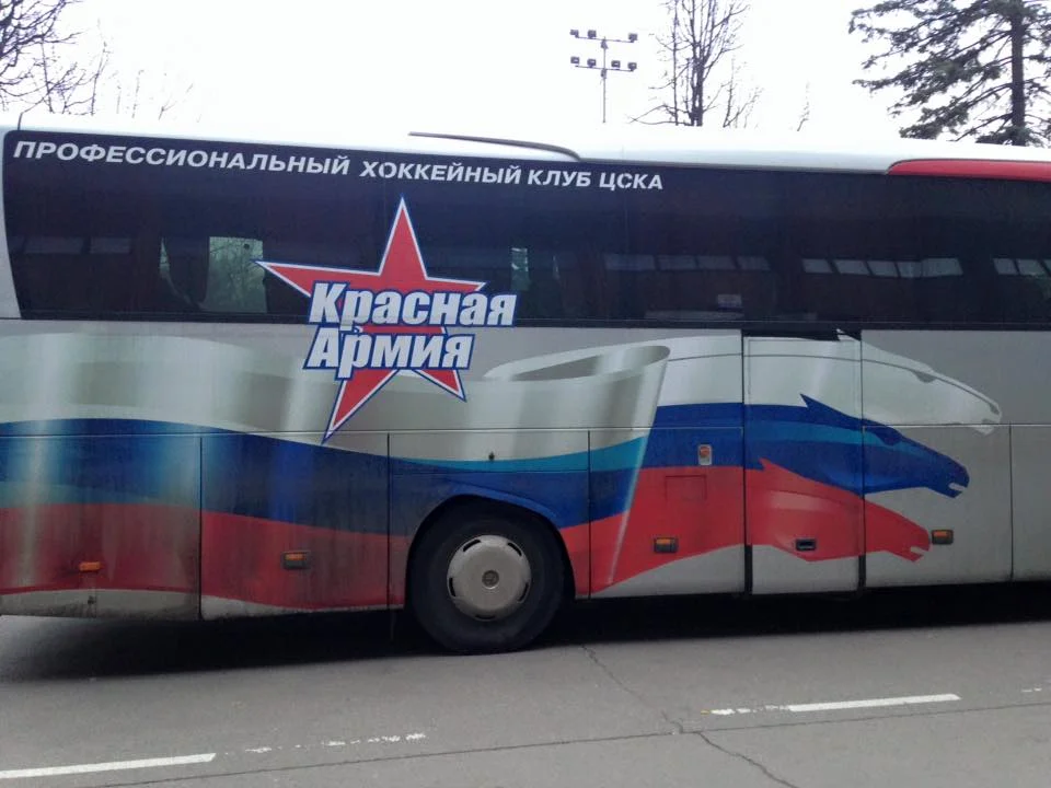 Yes, this is a bus for a Russian hockey team. It is unlikely to stop for you.