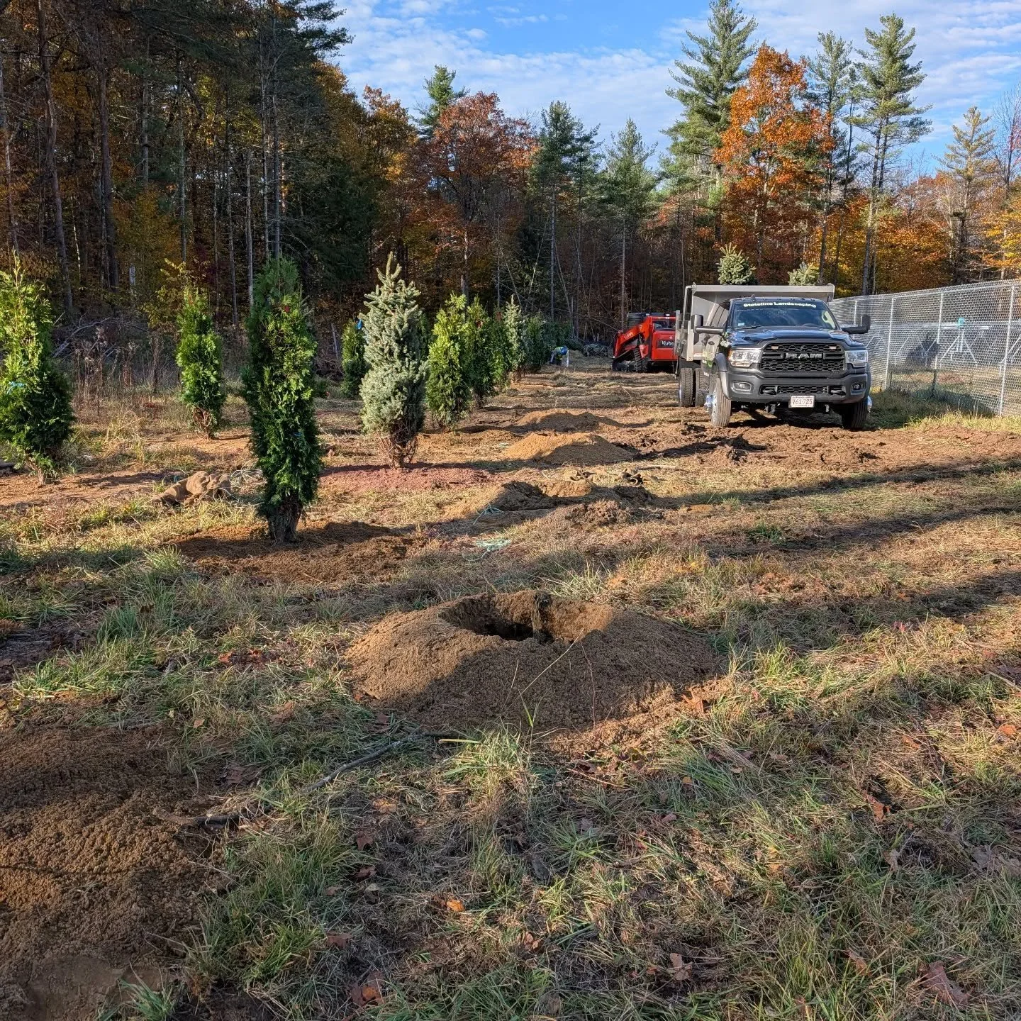Beautiful day for some planting! Dodging the rain and lightning this week but the boys are getting it done! #plants #trees #ram #kubota
