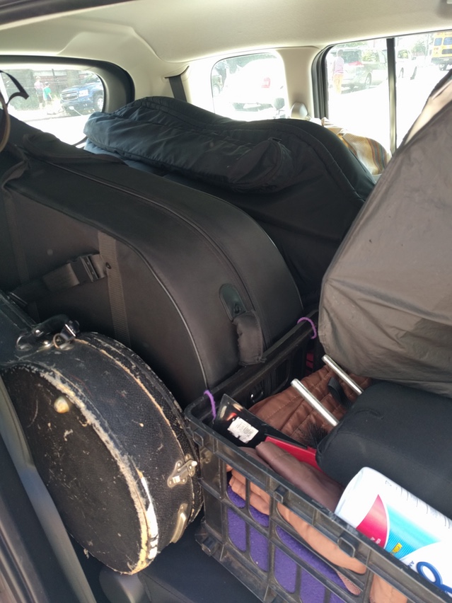 Packing up the kids (Left to Right: Banjo, Tuba, Bass. Not pictured: Saxophone, Clarinet, Flute)