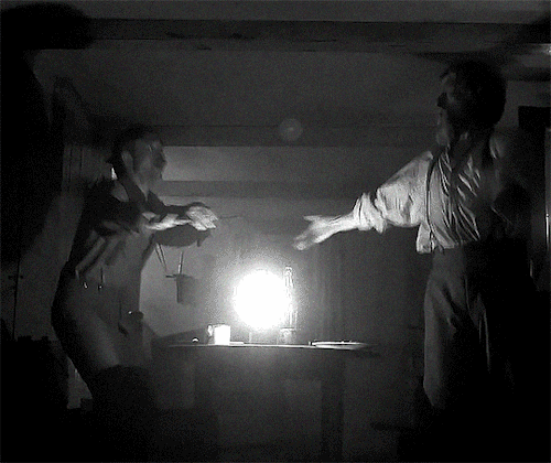 A gif of Willem Dafoe and Robert Pattinson dancing from The Lighthouse