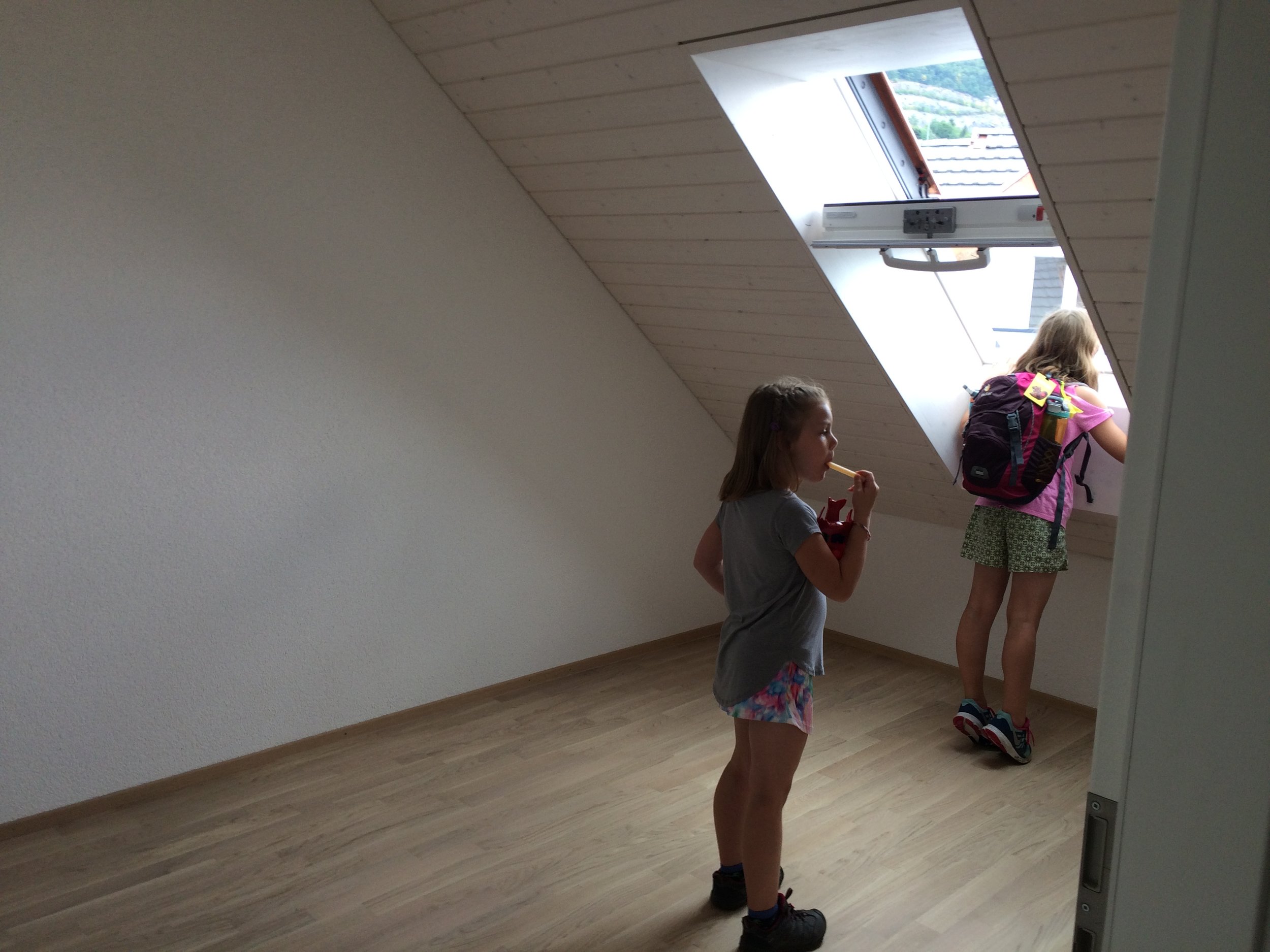 Apartment hunting with backpacks and popsicles. Views out the window imperative to the right choice - this apartment was the winner - Harry Potter style stair hideout thank you very much!