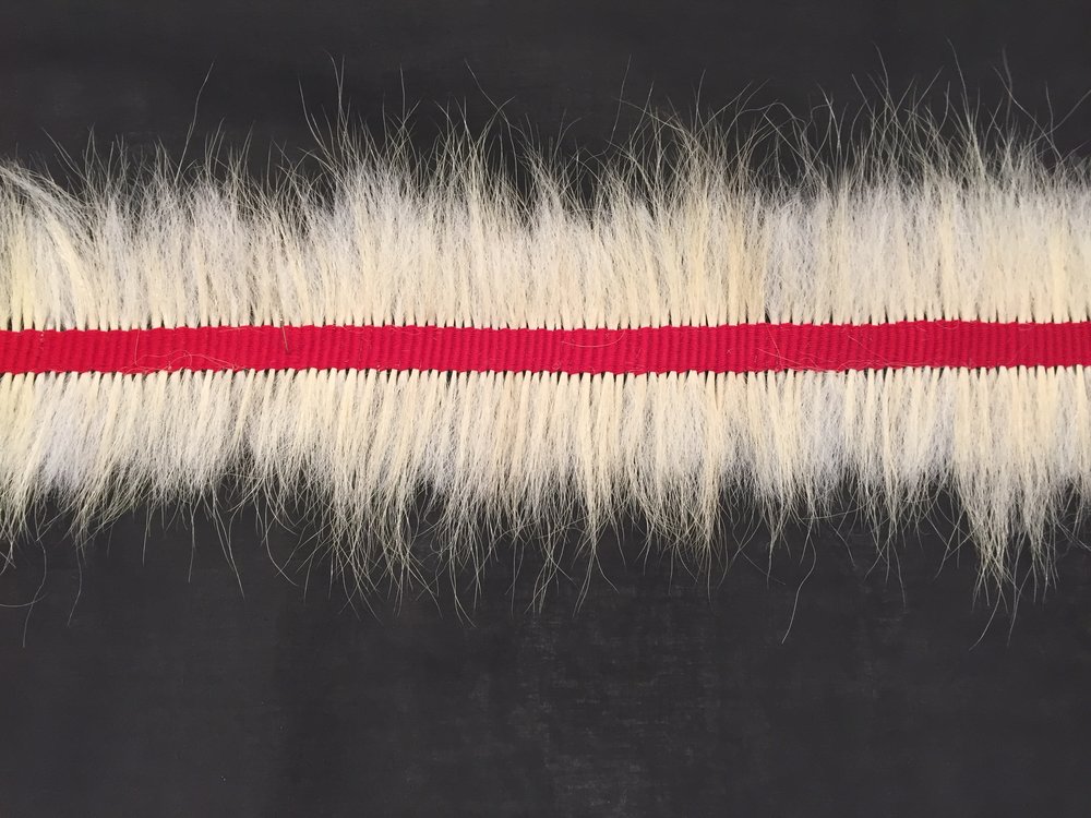 Message, 2017 (Detail) 180” x 24”, Polar bear guard hair, cotton thread, black interface
