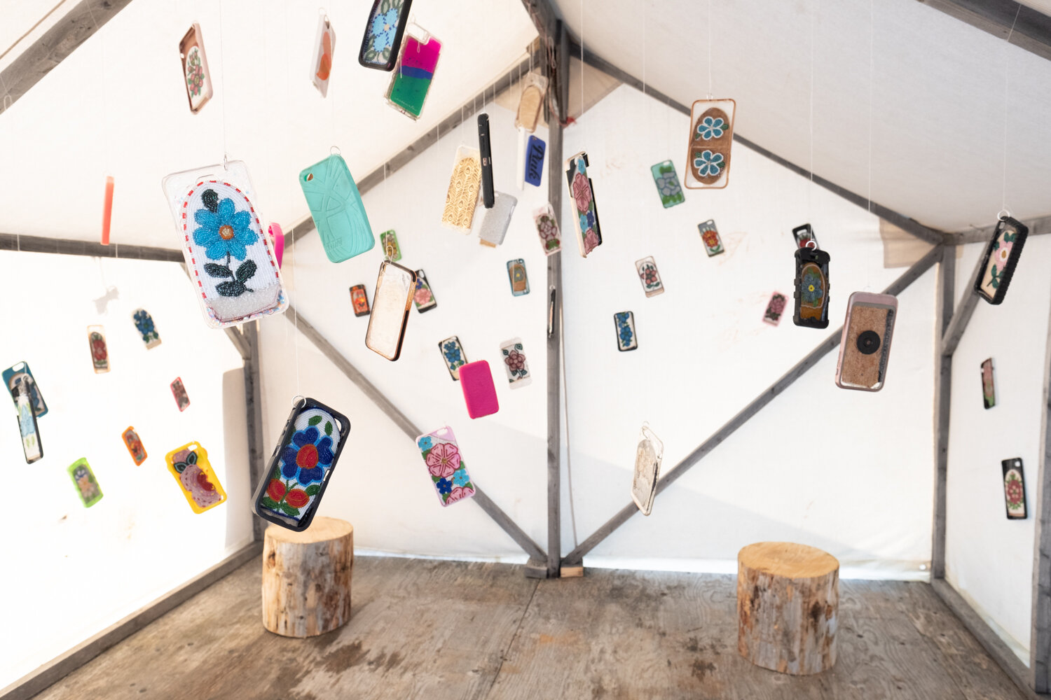   Big Hello  (2021) Beaded uppers, cell phone cases; 112 pieces, Dimensions variable Installation view June 2021, Husky Lakes, NWT  