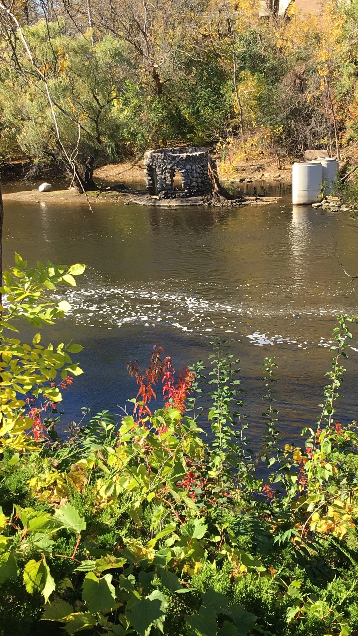Rum River below the dam where a historic stone playhouse sits