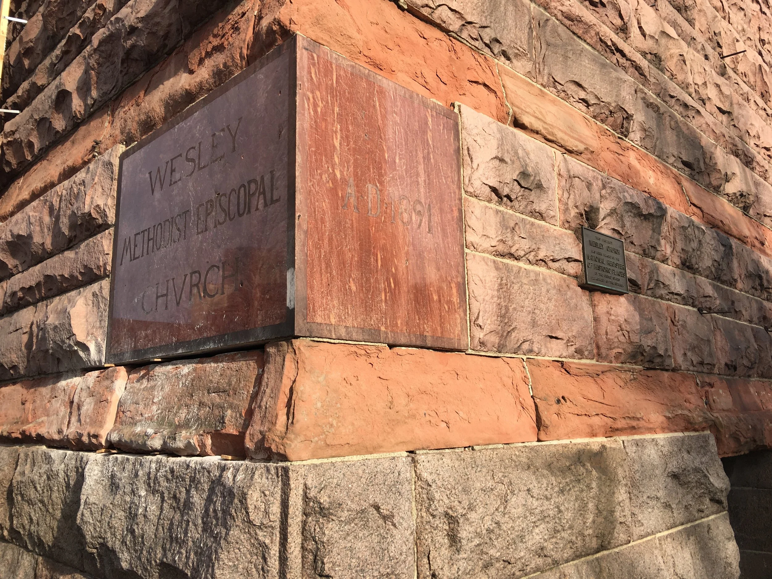 The sandstone block under the left portion of the cornerstone was cut in order to extract the memorobilia box 