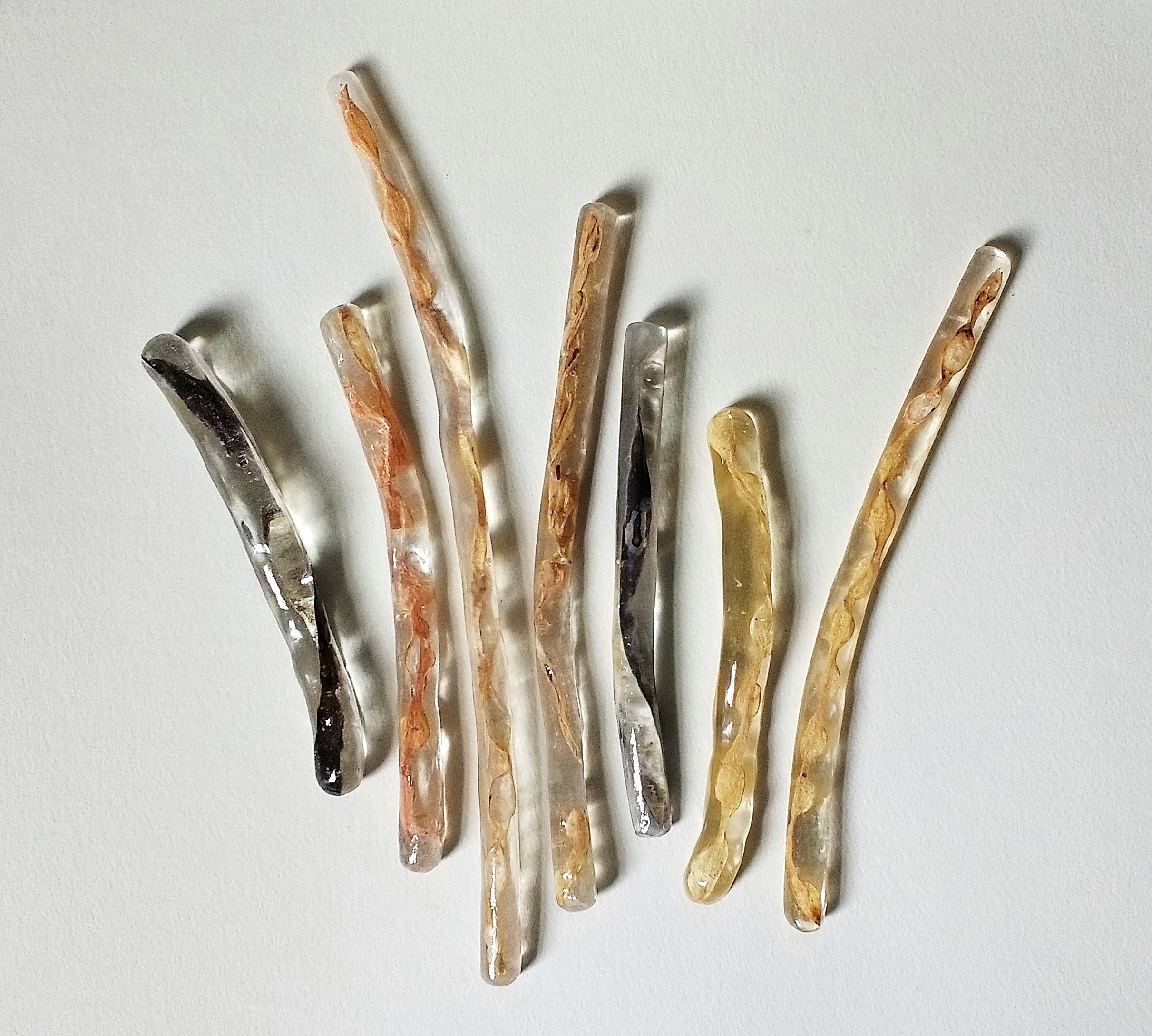 Cynthia Scott, Podz, 2017. Dried bean pods, resin