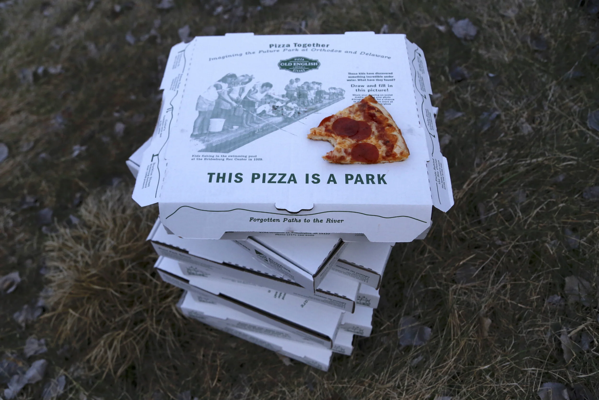 Pizzas stacked at the site of the future riverside park.JPG