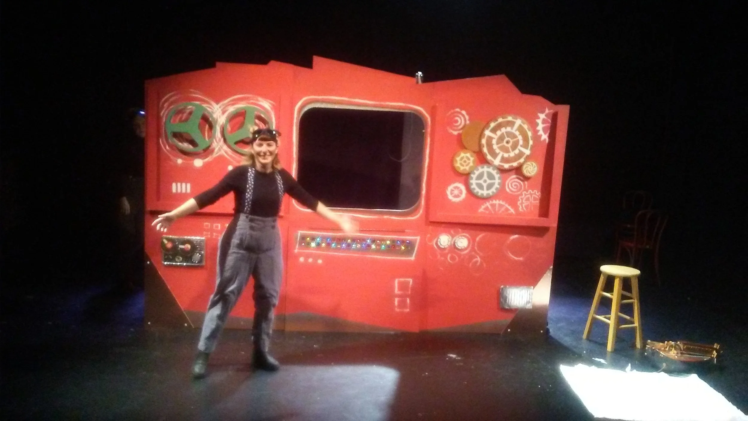 the finished machine, in all its glory! The gears and reels turn, the lights twinkle, and many of these pieces fall off strategically as the machine breaks in the show!