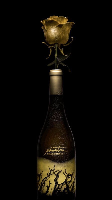 A gilded rose coming out of a Phantom wine bottle, unfurling and closing in an infinite loop.