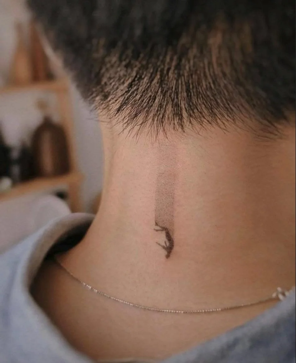Symbolic Falling Figure Tattoo