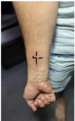 Minimal cross tattoo
