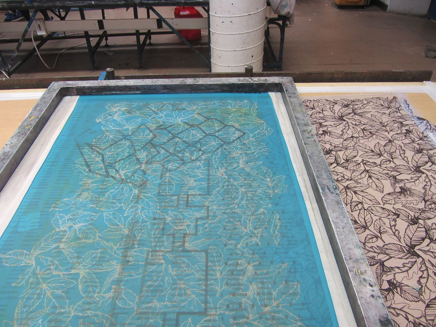 In the screen print studio the leaf drawings are printed onto fabric