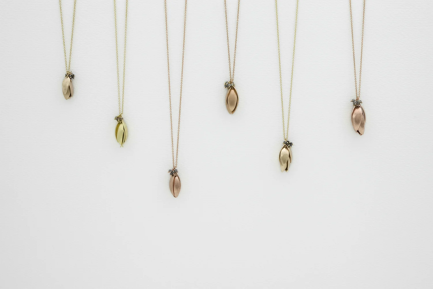 Nestling Pendants in Golds