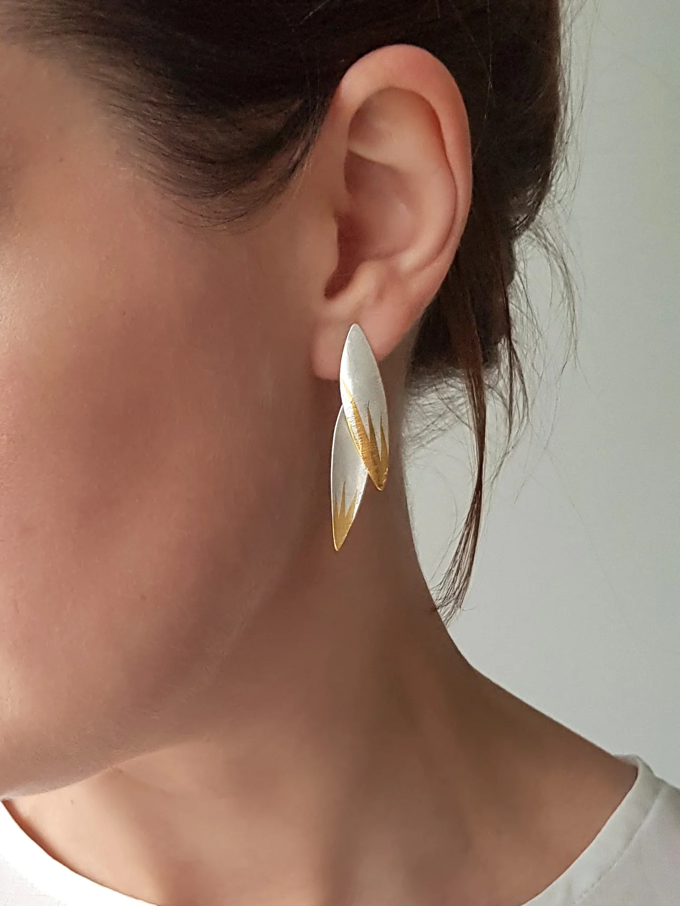 Plume Earrings being worn