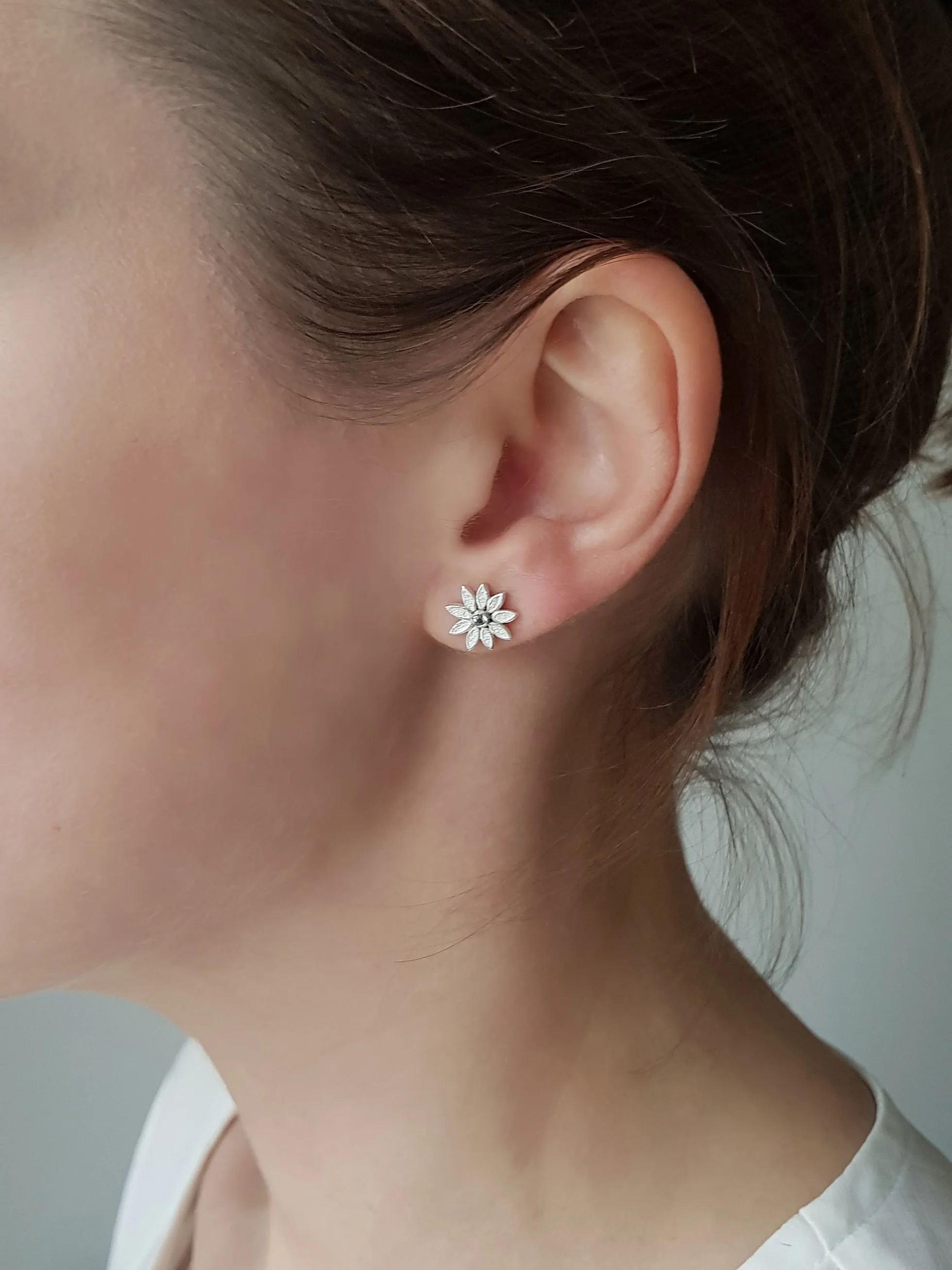 Moonflower studs being worn