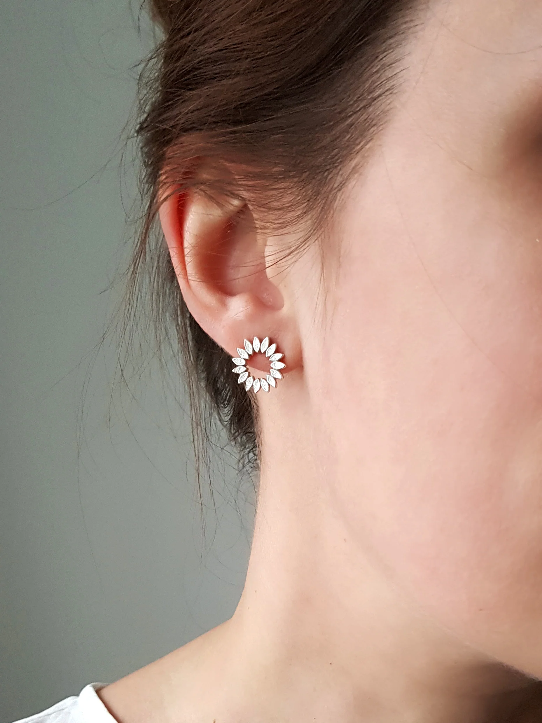 Silver Petal Halo Studs being worn