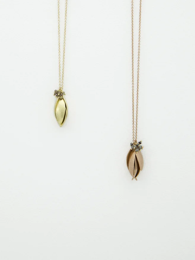 gold nestling pendants.jpg