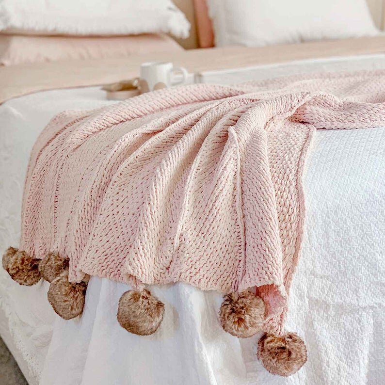 blush pink pom pom blanket