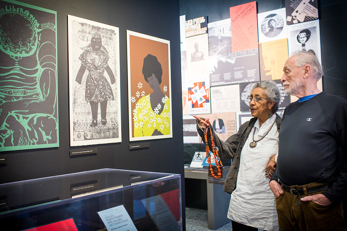 Camille Billops and James V. Hatch visiting the exhibition Still Raising Hell, September, 2016.