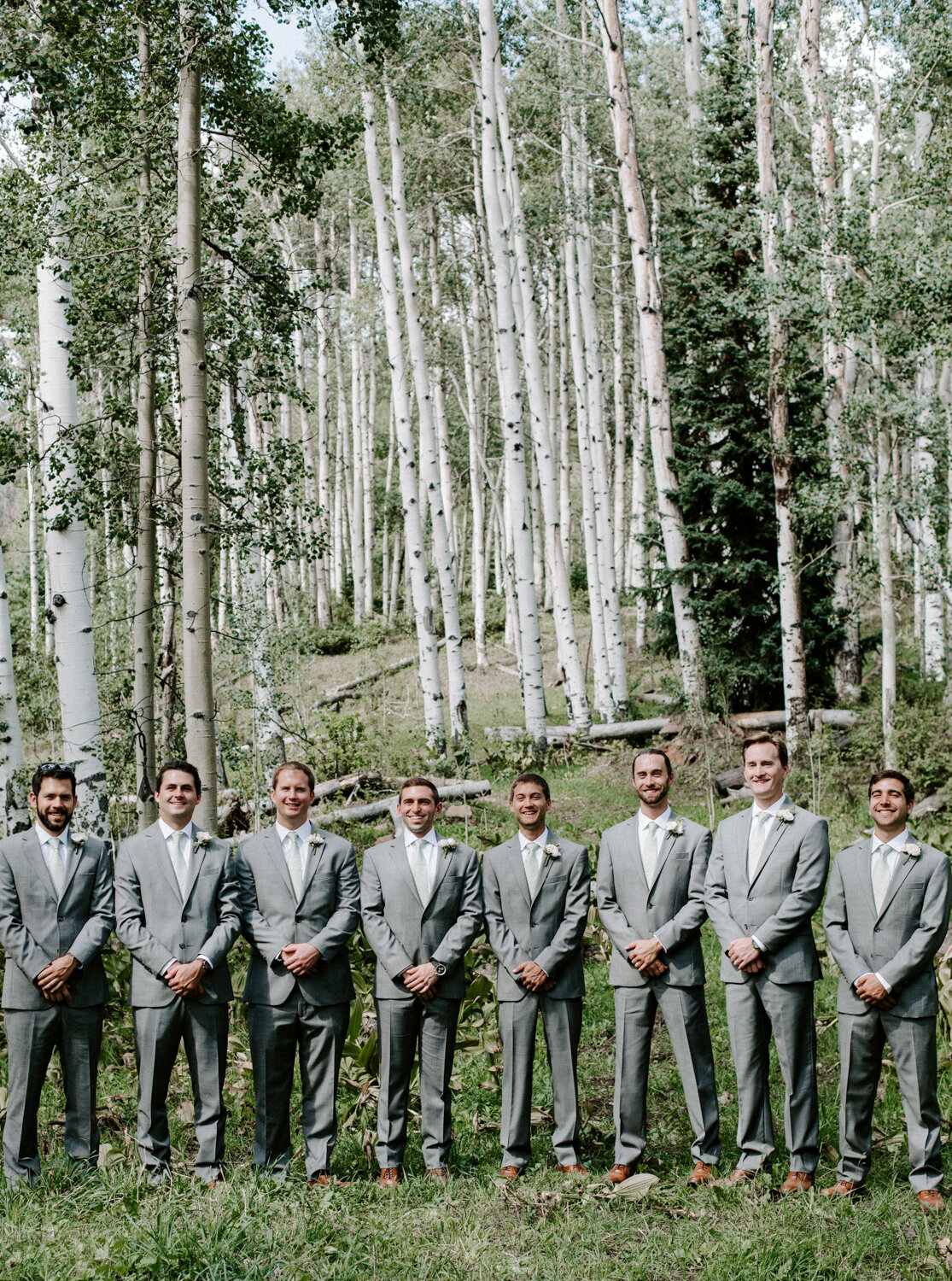 Groom and Groomsman celebrating a wedding at Eaton Ranch in Vail, CO before social distancing and quarantine with colorado wedding and elopement photographer Diana Coulter