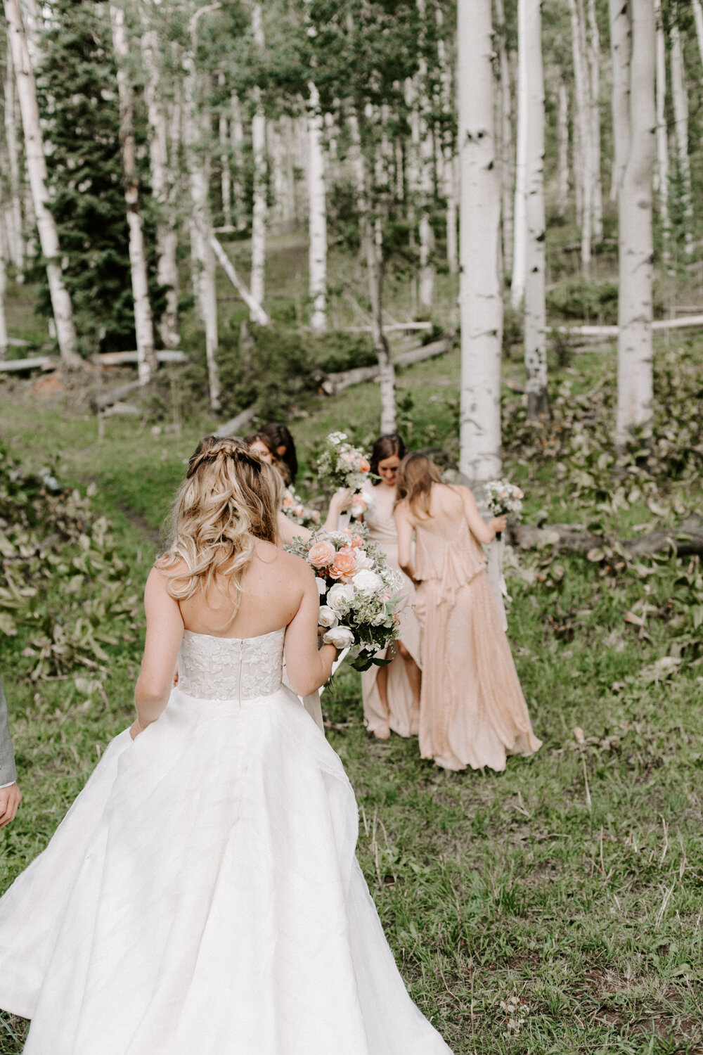 Brides and bridesmaids celebrating a wedding at Eaton Ranch outside of Vail, Colorado before social distancing and quarantine with Rocky Mountain Wedding and Elopement photographer Diana Coulter