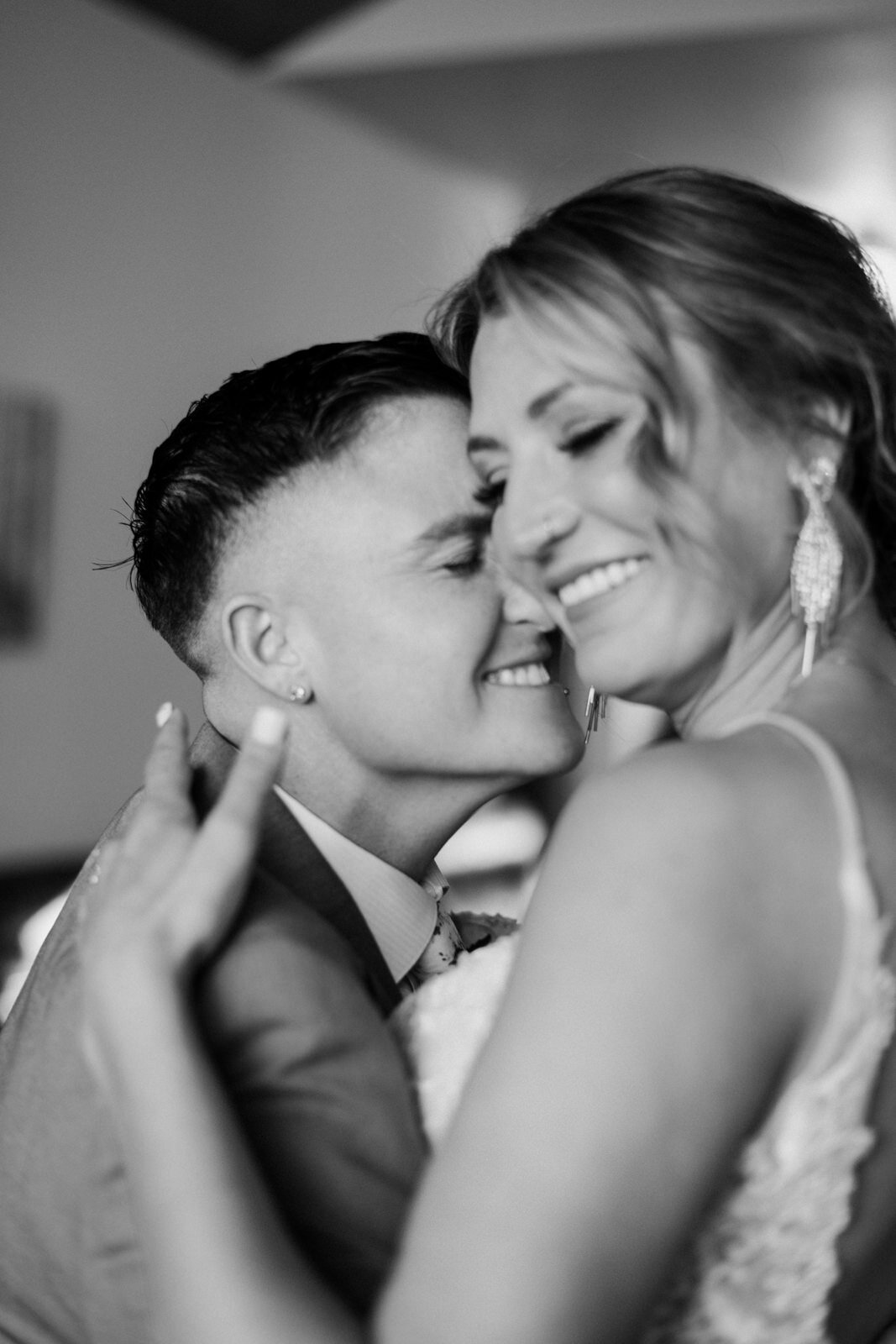 black and white photo of LGBTQ couple first dance at Estes Park AirBnB Elopement with Colorado elopement photographer Diana Coulter