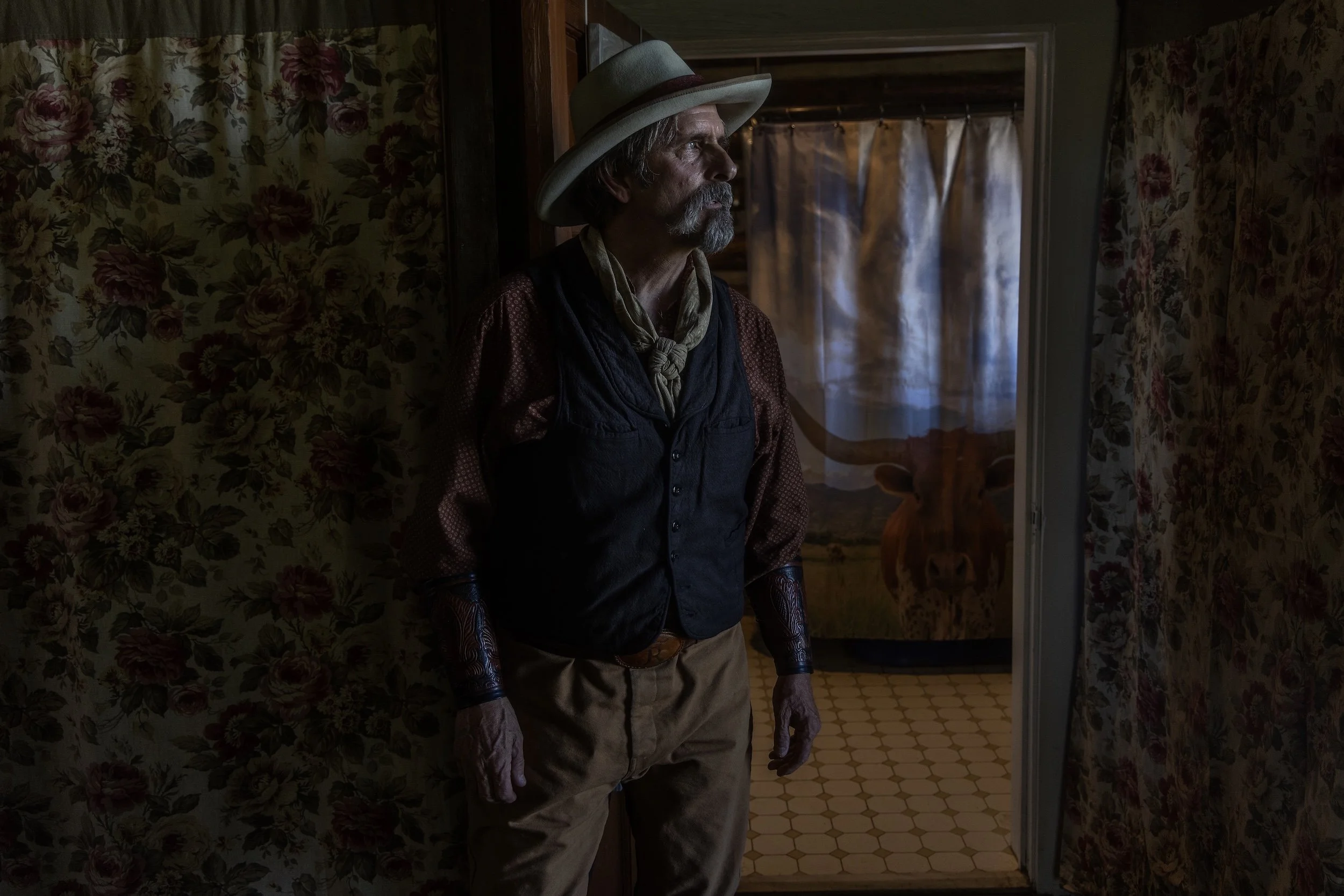 A color photo portrait of a cowboy photographed in his home in Natchez, Mississippi, by contemporary fine art photographer Alon Skuy for Conde Contemporary.