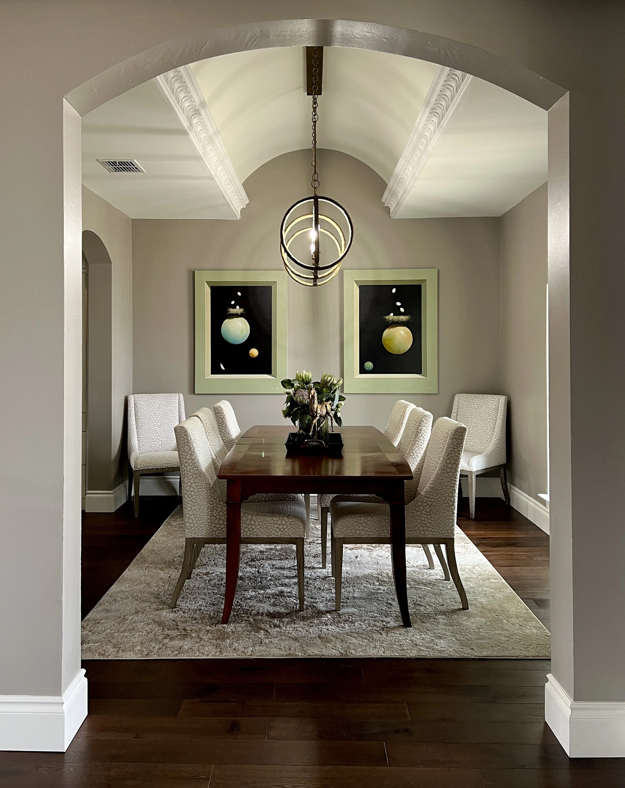 An image of two Jeff Faust paintings hung in the dining room acquired through Conde Contemporary as part of a private collection.