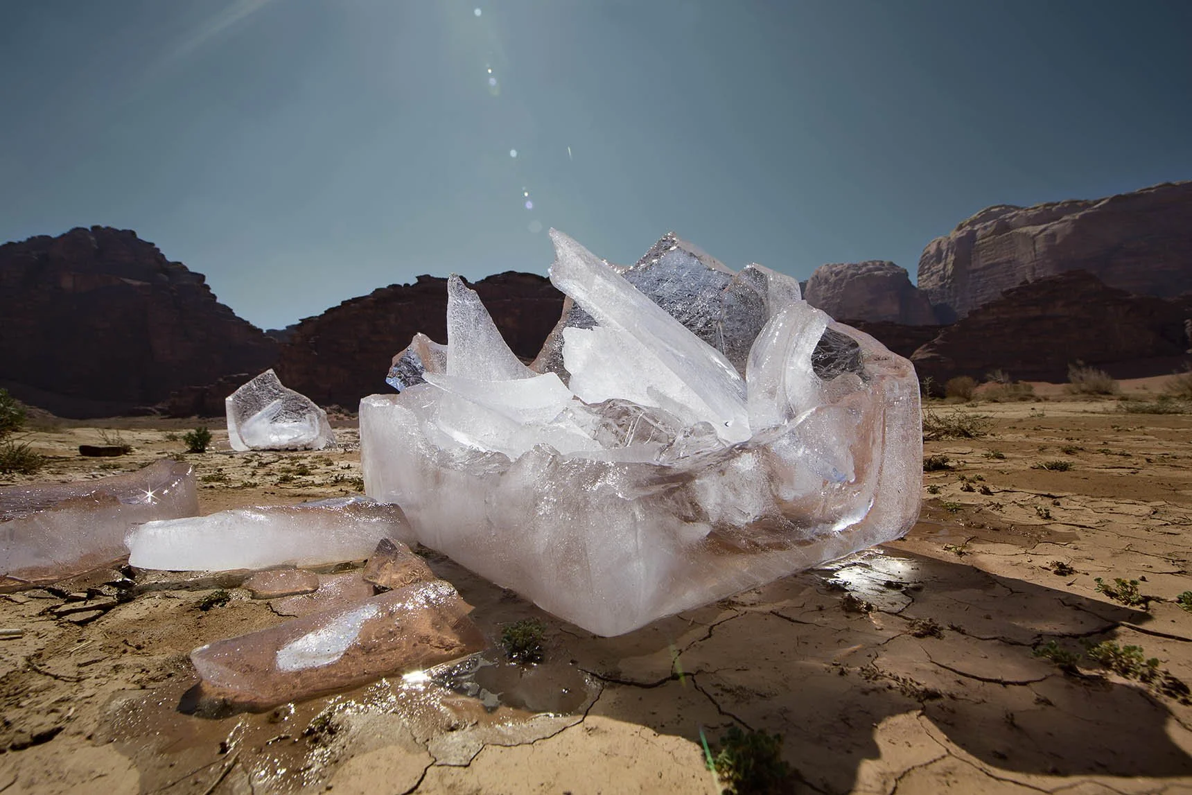 A photograph which is part of the Ice Project Series, by Russian photographer Natasha Kertes represented by Conde Contemporary, of two giant blocks of ice melting in the Wadi Rum desert in Jordan.