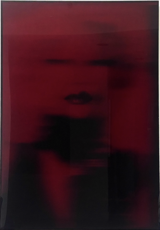 A blurry photo of a woman with bold lips, the photo is encased in a deep red plexiglas shadow box and titled Chinoiserie by contemporary Russian photographer Natasha Kertes, available at Conde Contemporary.