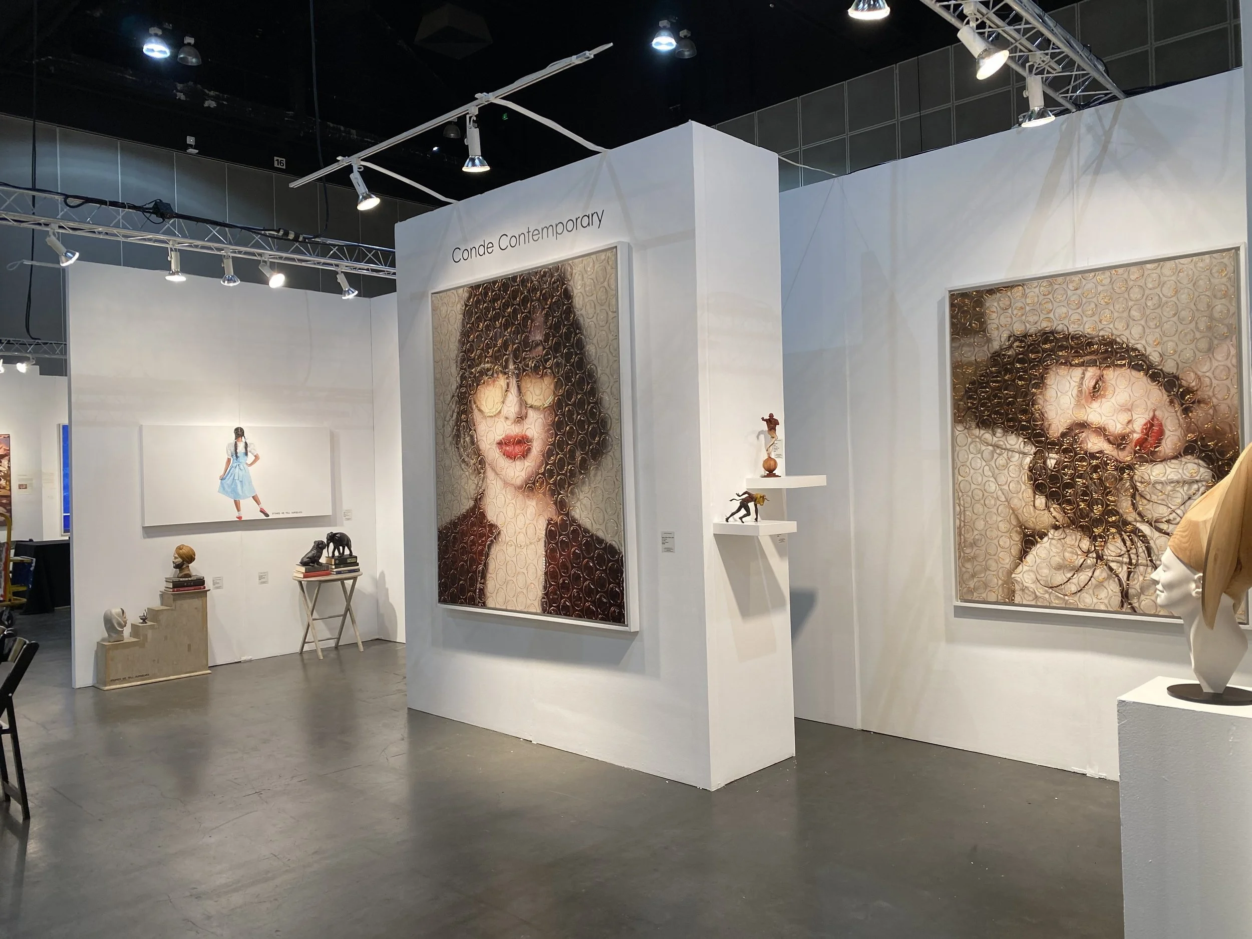Conde Contemporary's booth at the LA Art Show, featuing work by Andrés Conde, Darian Mederos, Rubén Torres Llorca, César Orrico, Kevin Sloan and others.