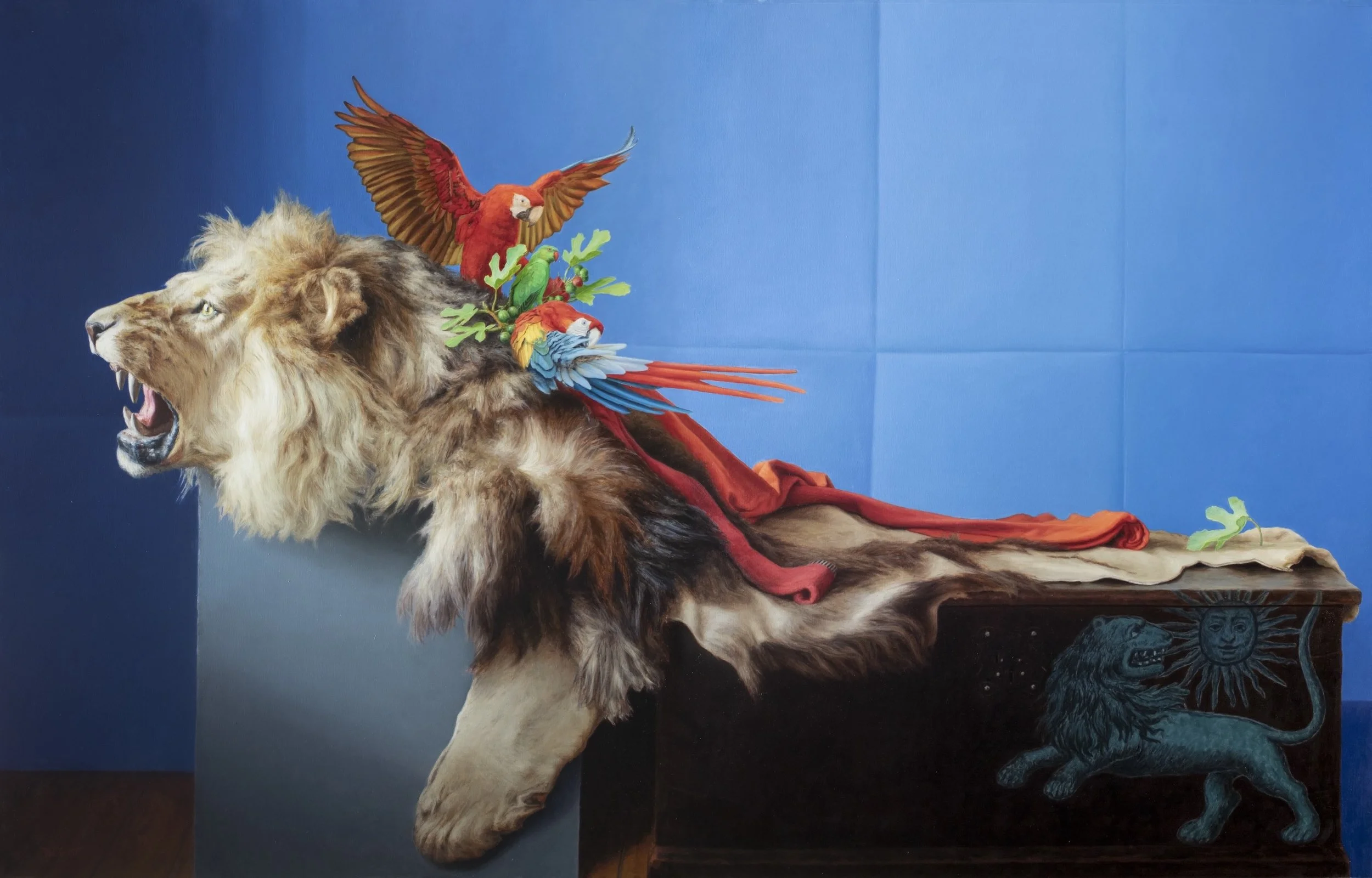 A realistic oil painting, titled Lion with Guacamayas, of a lion with guacamayas, or parrots on it's back by Latin American artist Pablo Santibáñez Servat for Conde Contemporary.