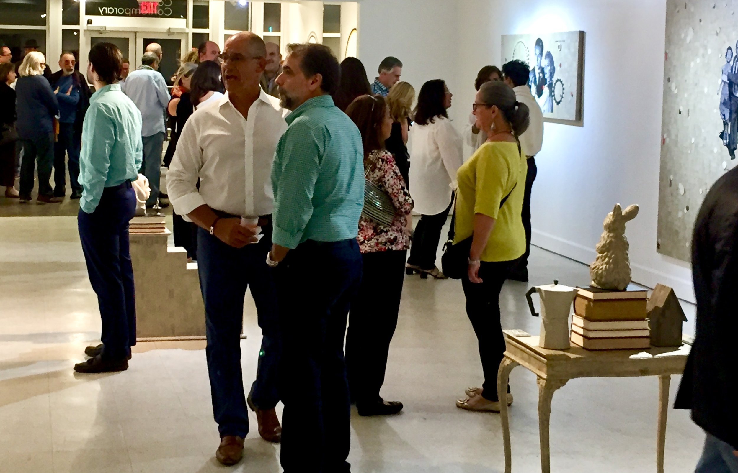 An image of people at the opening of a solo exhibition for contemporary Cuban master Rubén Torres Llorca at Conde Contemporary's former location in Coral Gables.