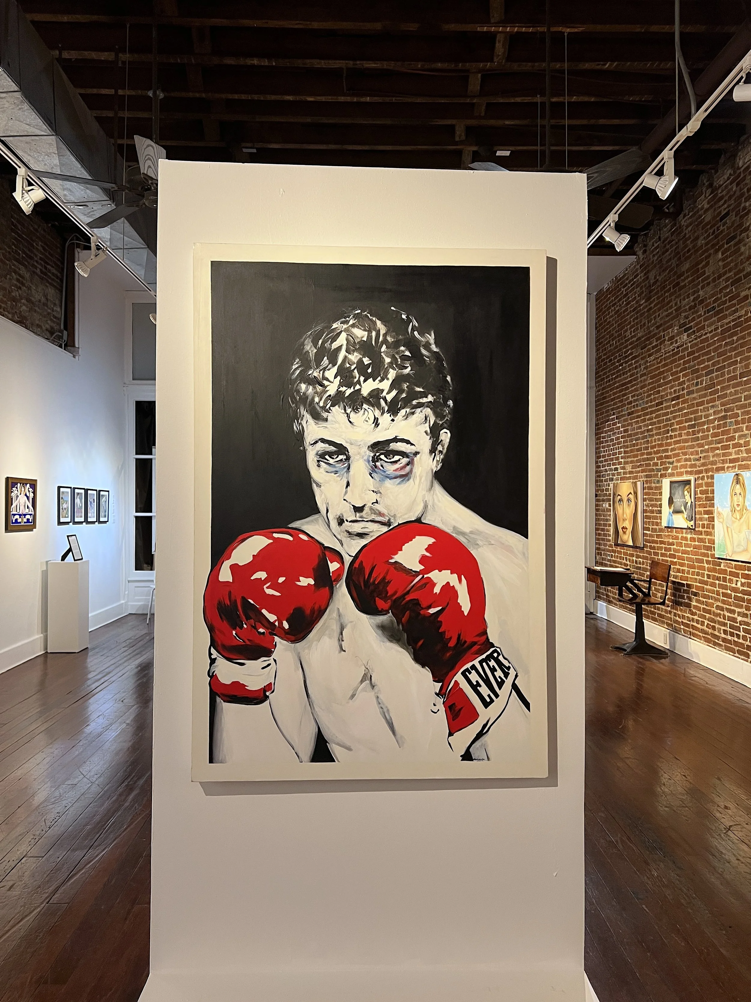An image of the solo exhibition Surface & Subtext for the Cuban artist Andrés Conde at Conde Contemporary and featuring an early painting in acrylic titled The Boxer.