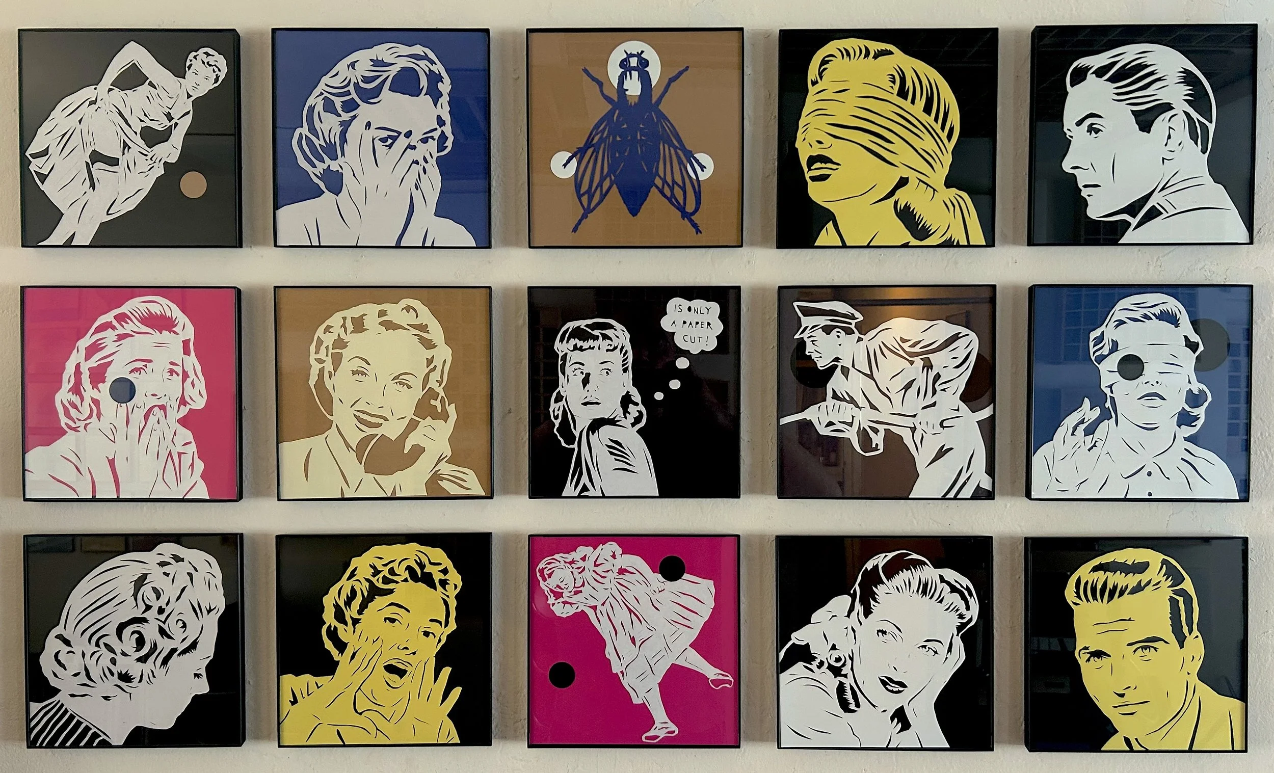 15 papercuts, cut works on paper, of retro looking men women and children, as well as a painted fly, with the central figure saying the title of the piece in a thought bubble, "It's Only A Papercut", by Cuban conceptual artist, Rubén Torres Llorca.