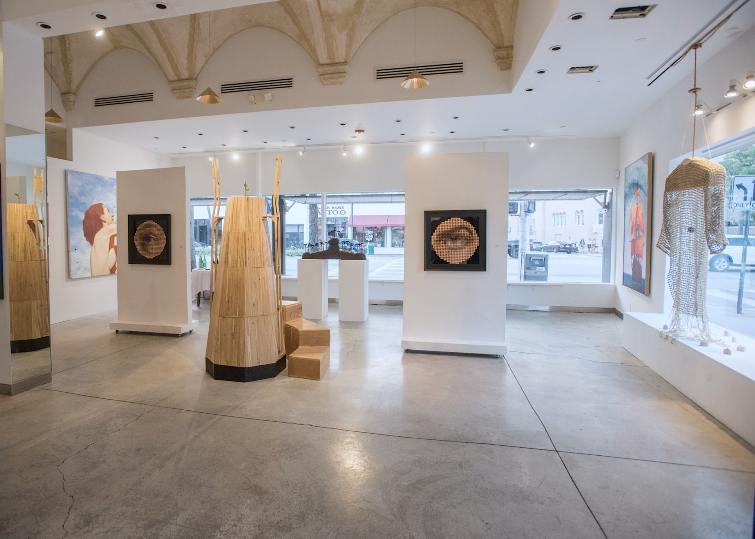 An image of Conde Contemporary's former location on Miami Beach, filled with works by Jose Bedia, Darian Mederos, Andres Conde, Heriberto Mora, Rubén Torres Llorca, Heriberto Mora, and Leonid Rotar.