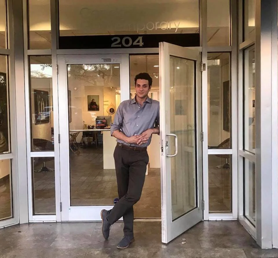 A photograph of Andrés Ángel Conde working at Conde Contemporary's former location in Coral Gables.