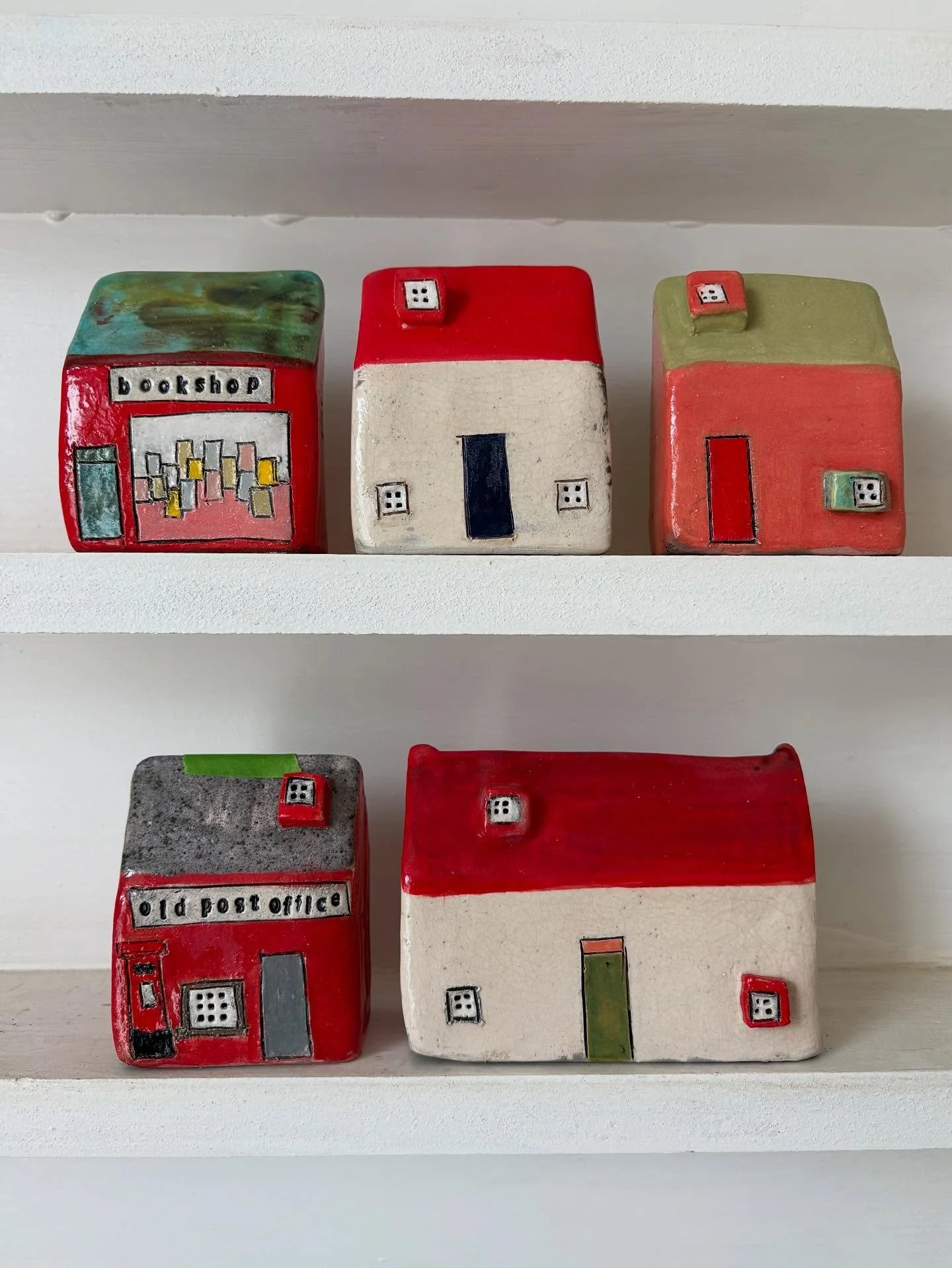 I am about to fire all the pieces for my next collection and am getting all my colour palettes in order to glaze the houses. 

Love seeing the houses in colour groups especially red which are really striking. 

My next sale will be next week and I am